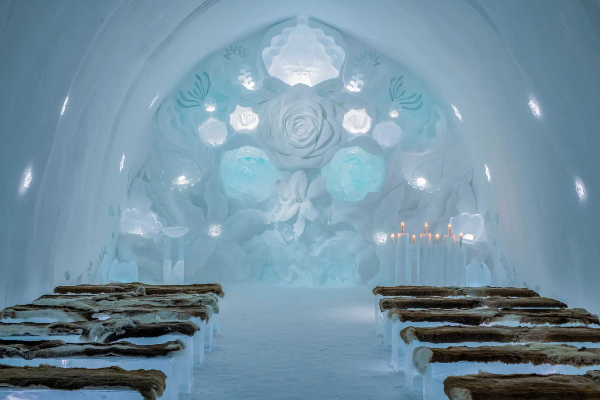 A corridor cut through packed snow, the shared material behind the ice hotels group